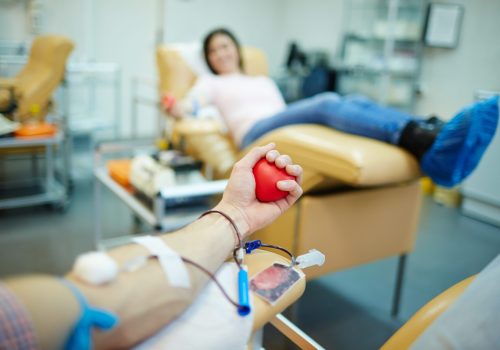 Donor of blood gripping hand-flexor